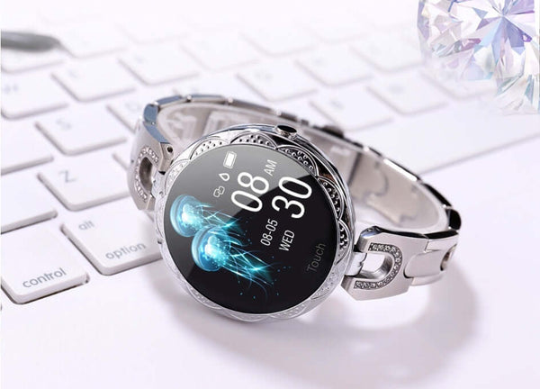 Chic Women's Smart Watch displayed on a keyboard showing a stylish design and digital interface.