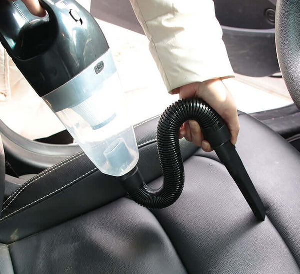 A person using the Portable Car Vacuum Pro to clean the car seats efficiently and effectively.