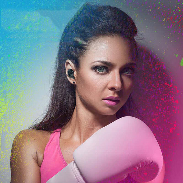Woman boxing while wearing Freedom Sound Sports Earbuds for superior sound quality during workouts.